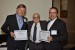 Dr. Nagib Callaos, General Chair, giving Prof. Frank-Michael Dittes and Mr. Gunter Teichmann the best paper award certificate of the session "Computer Science and Engineering." The title of the awarded paper is "Rethinking Public Transportation and Logistics as Collaborative Scenarios."